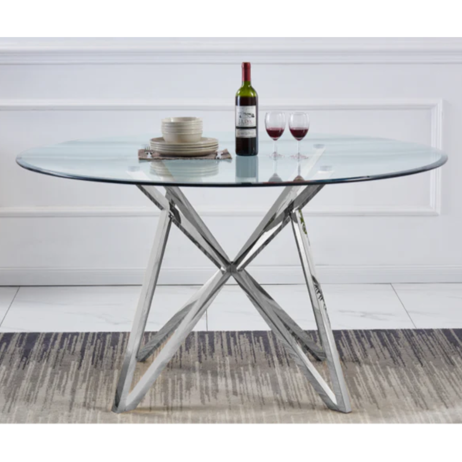 Table à manger avec plateau transparent et pieds en acier inoxydable.